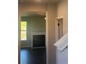 View of the living room with a fireplace and adjacent doorway at 1151 Park Center Cir, Austell, GA 30168