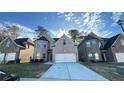 Inviting two-story brick home with a well-maintained front lawn and ample driveway space at 265 Sanctuary Dr, Lawrenceville, GA 30046