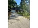 Long driveway leading to a lovely ranch style home with attached garage at 2661 Throatlatch Sw Ln, Marietta, GA 30064