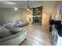 Spacious living room featuring a stone fireplace and light-colored wood floors at 2661 Throatlatch Sw Ln, Marietta, GA 30064