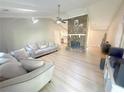 Bright living room featuring vaulted ceilings, wood floors and a stone fireplace at 2661 Throatlatch Sw Ln, Marietta, GA 30064
