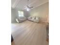 Open living room features wood flooring, coffered ceilings, and neutral paint at 2661 Throatlatch Sw Ln, Marietta, GA 30064