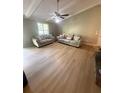 Bright living room with vaulted ceilings, light wood floors, and neutral décor at 2661 Throatlatch Sw Ln, Marietta, GA 30064