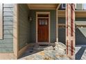 Inviting front entrance with a wooden door, stone steps, and a decorative bench at 2765 Prado Ln, Marietta, GA 30066