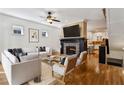 Bright living room with fireplace, flat screen TV, and hardwood floors open to kitchen area at 2765 Prado Ln, Marietta, GA 30066