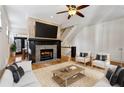 Living room with fireplace and hardwood floors with staircase leading upstairs at 2765 Prado Ln, Marietta, GA 30066