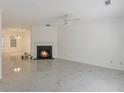 Bright living room featuring a fireplace and sleek marble flooring, creating a modern aesthetic at 5090 Leeshire Trce, Tucker, GA 30084