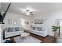 Spacious living area with white walls, hardwood floors, and comfortable seating arrangement at 6315 Princeton Ridge Dr, Lithonia, GA 30058