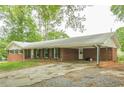 Ranch-style home featuring a covered carport, and a quaint front porch at 4935 Golden Sw Cir, Mableton, GA 30126