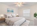 Cozy bedroom with a large bed, soft rug, and bright window at 502 Brighton Pt, Atlanta, GA 30328