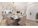 Bright dining area open to the living room showcases a white table and chairs at 502 Brighton Pt, Atlanta, GA 30328