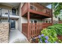 Charming condo exterior with stone accents, black door and decorative accents on the porch at 502 Brighton Pt, Atlanta, GA 30328