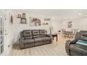Comfortable living room boasts a large sofa and an open dining area at 502 Brighton Pt, Atlanta, GA 30328