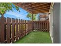 Private patio with artificial turf and wooden fence, ideal for relaxation at 502 Brighton Pt, Atlanta, GA 30328