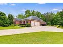 A spacious three-car garage and large driveway complement this charming home at 7511 Biltmore Ln, Douglasville, GA 30135