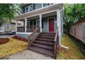 Inviting front porch with wooden stairs and fresh landscaping at 802 Chestnut Nw, Atlanta, GA 30314
