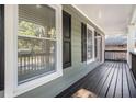 Covered front porch featuring black wood floors and white columns at 802 Chestnut Nw, Atlanta, GA 30314