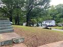 Peaceful neighborhood street showing a home with other houses and cars parked nearby at 2545 Saint Patrick Se St, Atlanta, GA 30317