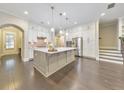 Spacious kitchen featuring white cabinets, a large island, and stainless steel appliances at 396 Summerhour St, Marietta, GA 30060