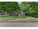 Beautifully landscaped home with mature trees and a well-maintained lawn at 511 Robinson Se Ave, Atlanta, GA 30315