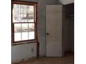 Bedroom showing closet and window for natural light ready for renovation at 4195 Turner Dr, Cumming, GA 30040