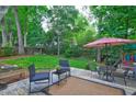 Lush backyard oasis with a wooden deck, mature trees, and plenty of space for outdoor enjoyment at 1160 Haven Brook Ne Way, Brookhaven, GA 30319