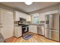 Well-appointed kitchen featuring stainless steel appliances, granite countertops, and bright white cabinetry at 1160 Haven Brook Ne Way, Brookhaven, GA 30319