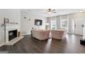 Bright living room with a fireplace, modern decor, and hardwood floors at 20 Pine Canyon Sw Dr # 26, Atlanta, GA 30331