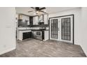Stylish kitchen featuring stainless steel appliances, black countertops, and ample cabinet space at 11 Peyton Place Sw, Atlanta, GA 30311