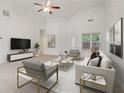 Bright, airy living room with vaulted ceilings, plush carpet, and modern furnishings for comfortable living at 1065 City Park Dr, Mcdonough, GA 30252
