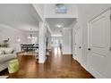 Spacious hallway connecting rooms, with hardwood floors, neutral paint, and bright natural light at 4050 Pleasant Woods Dr, Cumming, GA 30028