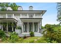 Beautiful home exterior with a balcony, a well-manicured lawn, and lush landscaping at 364 Glendale Ne Ave # B, Atlanta, GA 30307