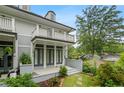 Charming two-story home with a balcony and beautifully landscaped front yard and gray siding at 364 Glendale Ne Ave # B, Atlanta, GA 30307