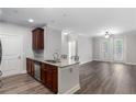 Kitchen features stainless steel appliances, granite countertops, dark cabinets, and an open floor plan at 901 Abernathy Ne Rd # 2050, Sandy Springs, GA 30328