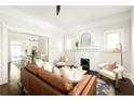 Bright living room featuring hardwood floors, a fireplace, and an open layout at 230 Milton Se Ave, Atlanta, GA 30315