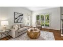 Cozy living room with neutral decor, natural light, and elegant furnishings creating a relaxing atmosphere at 4679 Glenshire Pl, Atlanta, GA 30338