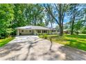 Wide angle of a single story home featuring an attached covered carport at 4103 Laynewood Cir, Tucker, GA 30084