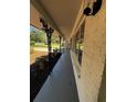 Inviting covered front porch featuring decorative iron supports, offering a charming curb appeal at 4103 Laynewood, Tucker, GA 30084