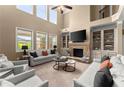 Bright living room features a stone fireplace and soaring ceilings at 4388 Cades Pointe, Marietta, GA 30066