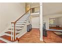 Bright foyer with hardwood floors and staircase leading to the second floor at 502 Fortune Ridge Rd, Stone Mountain, GA 30087