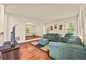 Cozy living room with hardwood floors, comfortable furniture, and natural light at 502 Fortune Ridge Rd, Stone Mountain, GA 30087