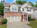 Attractive two-story home with a brick and siding exterior and attached two car garage at 47 Gloster Mill Way, Lawrenceville, GA 30044