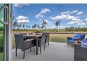 Outdoor dining space with table, chairs and backyard views. Comfortable seating arrangement also visible at 508 Regency Trl, Acworth, GA 30102