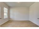 Clean, freshly painted bedroom with ample natural light and plank floors at 76 Homesite Dulles Dr, Mcdonough, GA 30253