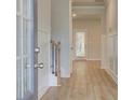 Inviting foyer features wood flooring and classic architectural details, creating a warm entrance at 76 Homesite Dulles Dr, Mcdonough, GA 30253