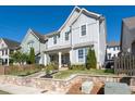 Charming two-story home boasts a quaint front porch, stone accents, and mature trees at 2100 Drew Nw Dr, Atlanta, GA 30318