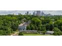 Scenic view of the Atlanta skyline surrounded by lush greenery and neighborhood homes at 339 Skylar Se Way, Atlanta, GA 30315
