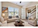 Bright living room featuring a neutral palette, large window, and stylish furnishings at 700 Ridgeway Ct, Canton, GA 30114