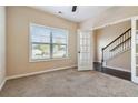 Bright office space with plush carpet, ample natural light, and a view to the staircase at 700 Ridgeway Ct, Canton, GA 30114