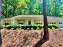 Beautiful home with a front porch, well-manicured landscaping, and a two-car garage at 3436 Finglas Dr, Marietta, GA 30008